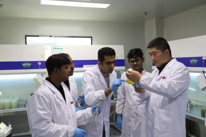 showing Pakistani and Chines agriculture researchers working
